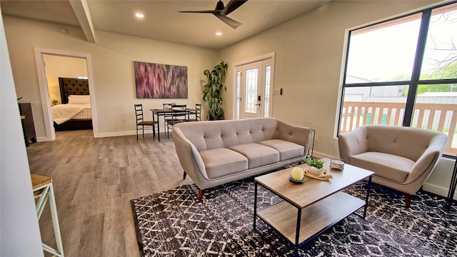 209 N Broad St, Saint Jo, TX 76265 - living room with ceiling fan, recessed lighting, wood finished floors, and baseboards