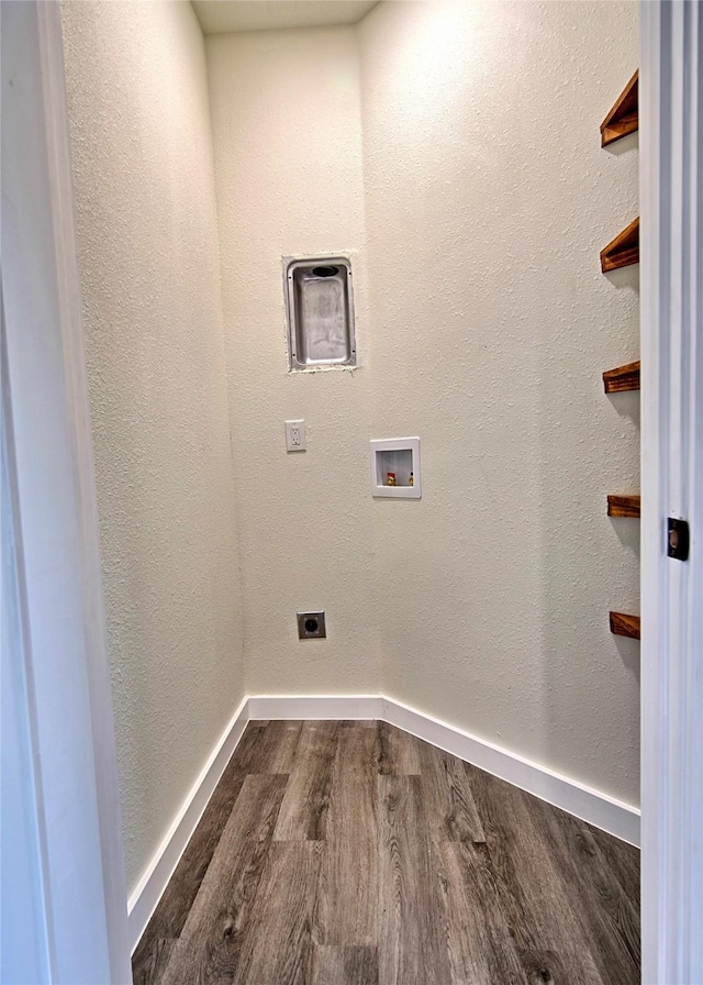209 N Broad St, Saint Jo, TX 76265 - laundry room with dark wood finished floors, electric dryer hookup, baseboards, and hookup for a washing machine