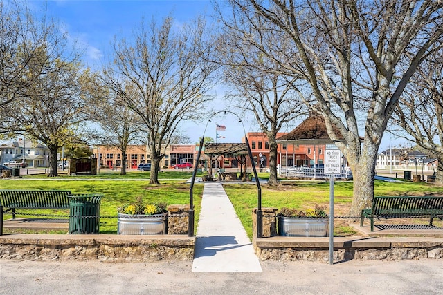 209 N Broad St, Saint Jo, TX 76265 - view of property's community featuring a lawn and a residential view