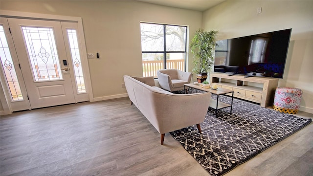 209 N Broad St, Saint Jo, TX 76265 - living area with wood finished floors and baseboards