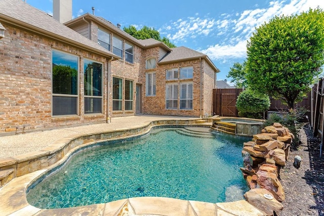 5909 Woodwind Dr, Plano, TX 75093 - view of swimming pool featuring a fenced backyard, a patio area, and a pool with connected hot tub