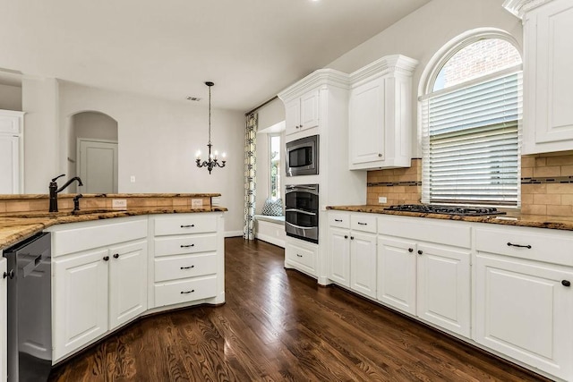 5909 Woodwind Dr, Plano, TX 75093 - kitchen featuring a sink, appliances with stainless steel finishes, dark wood-type flooring, dark stone countertops, and backsplash