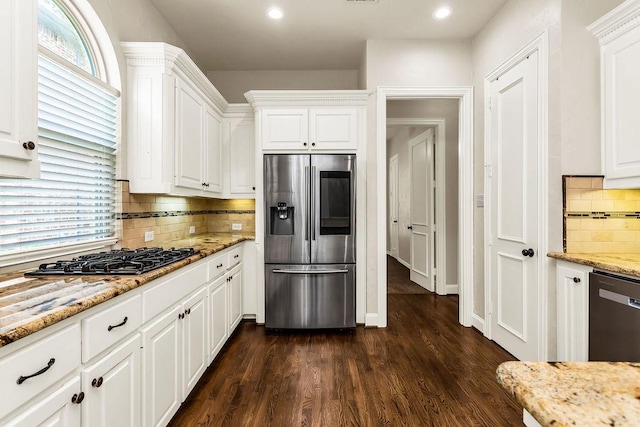 5909 Woodwind Dr, Plano, TX 75093 - kitchen with stainless steel refrigerator with ice dispenser, black gas stovetop, tasteful backsplash, white cabinetry, and recessed lighting