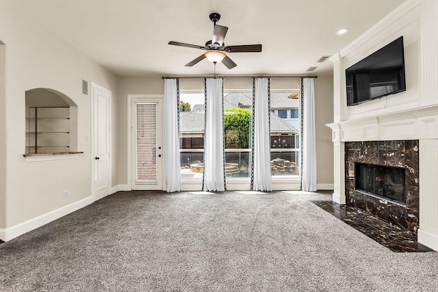 5909 Woodwind Dr, Plano, TX 75093 - unfurnished living room featuring a ceiling fan, baseboards, a high end fireplace, carpet flooring, and recessed lighting