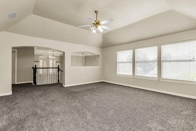 5909 Woodwind Dr, Plano, TX 75093 - empty room featuring a ceiling fan, baseboards, vaulted ceiling, and plenty of natural light