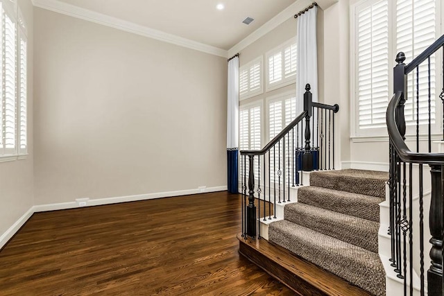 5909 Woodwind Dr, Plano, TX 75093 - stairs featuring wood finished floors, crown molding, and baseboards