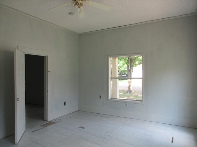 1203 Sewanee Dr, Marlin, TX 76661 - empty room featuring ceiling fan, baseboards, light flooring, and a textured ceiling
