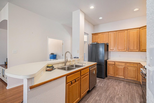 813 Royal Oak Ln, Burleson, TX 76028 - kitchen with a sink, freestanding refrigerator, dishwasher, light wood-style floors, and range