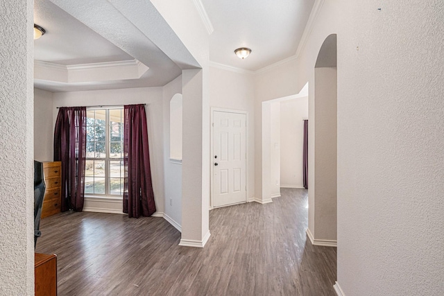813 Royal Oak Ln, Burleson, TX 76028 - foyer entrance featuring arched walkways, ornamental molding, wood finished floors, baseboards, and a textured wall