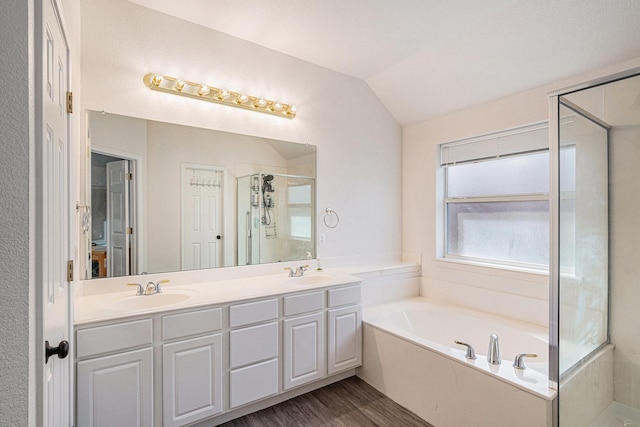 813 Royal Oak Ln, Burleson, TX 76028 - full bath featuring a garden tub, double vanity, an enclosed shower, lofted ceiling, and wood finished floors