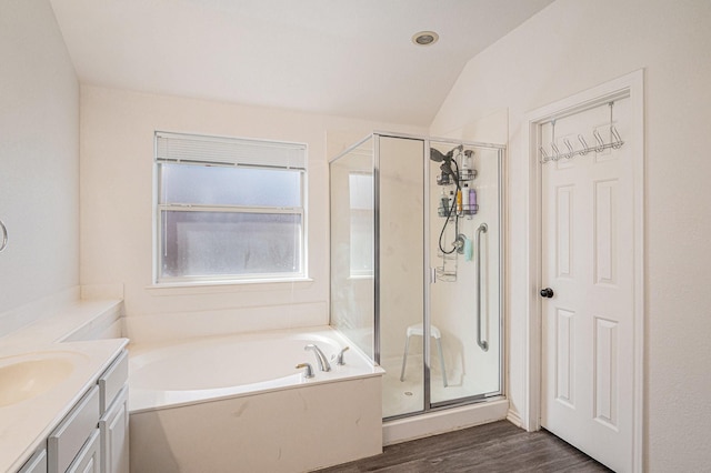 813 Royal Oak Ln, Burleson, TX 76028 - full bathroom featuring vanity, a stall shower, a bath, wood finished floors, and lofted ceiling