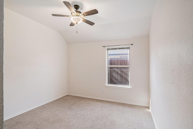 813 Royal Oak Ln, Burleson, TX 76028 - unfurnished room with light colored carpet, vaulted ceiling, a ceiling fan, and baseboards