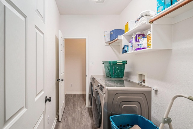 813 Royal Oak Ln, Burleson, TX 76028 - laundry area featuring washing machine and clothes dryer, wood finished floors, and baseboards
