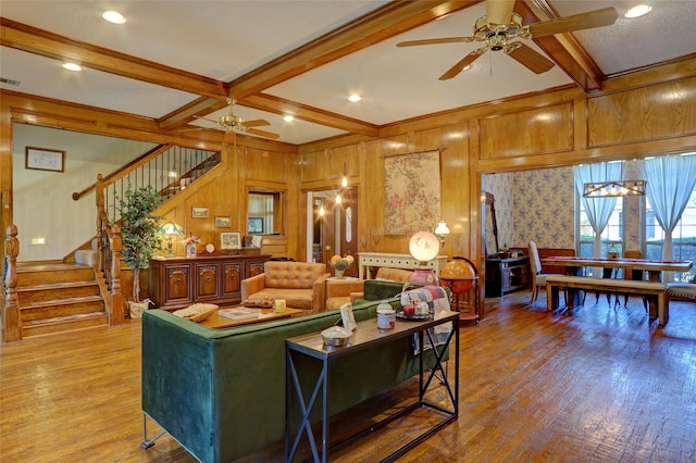 3908 Jamestown Pl, Plano, TX 75023 - living area featuring ceiling fan, beam ceiling, stairs, wood finished floors, and wood walls