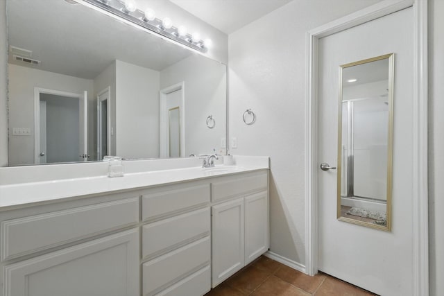 1900 Cassandra Ct, Fort Worth, TX 76131 - bathroom featuring vanity, tile patterned floors, baseboards, and a shower