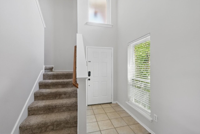 1900 Cassandra Ct, Fort Worth, TX 76131 - entryway featuring stairway, plenty of natural light, light tile patterned flooring, and baseboards