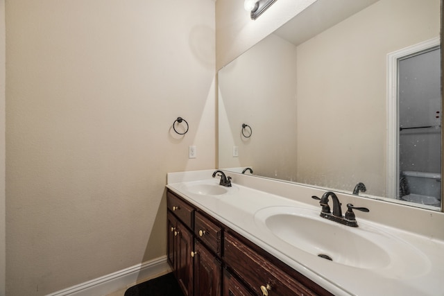 5005 Dominion Blvd, Irving, TX 75038 - full bathroom featuring double vanity and baseboards