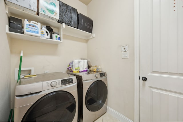 5005 Dominion Blvd, Irving, TX 75038 - laundry area featuring washer and dryer, baseboards, and tile patterned floors