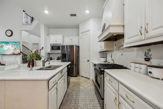 5005 Dominion Blvd, Irving, TX 75038 - kitchen featuring custom range hood, stainless steel appliances, a sink, white cabinetry, and light countertops