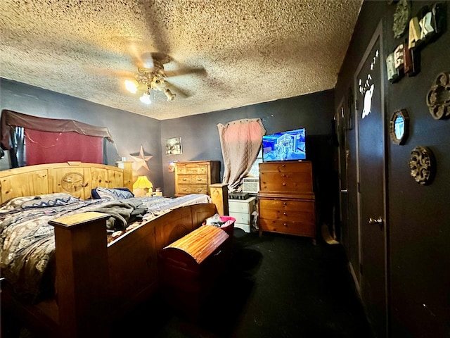 903 College St, Sulphur Springs, TX 75482 - bedroom with a textured ceiling, dark colored carpet, and a ceiling fan