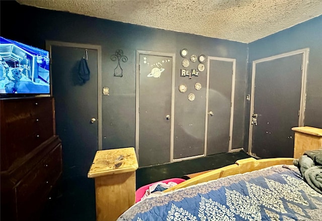 903 College St, Sulphur Springs, TX 75482 - bedroom featuring a textured ceiling