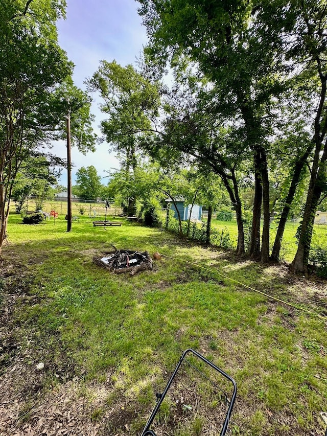 903 College St, Sulphur Springs, TX 75482 - view of yard with a fire pit