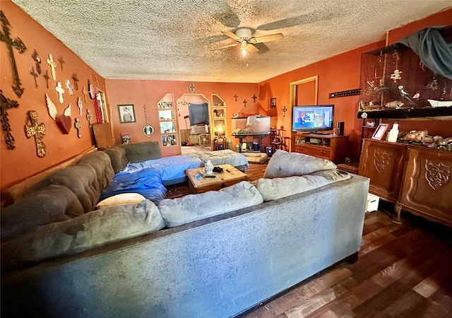 903 College St, Sulphur Springs, TX 75482 - living area featuring wood finished floors, a ceiling fan, and a textured ceiling