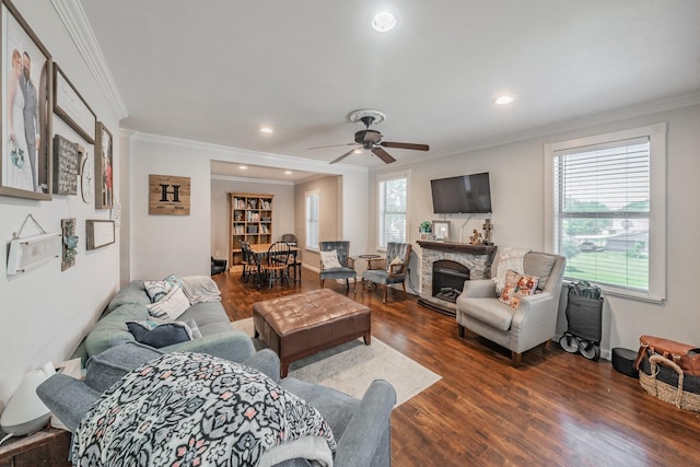 300 E Shoemaker St, Decatur, TX 76234 - living room with dark wood-style flooring, a ceiling fan, ornamental molding, recessed lighting, and a stone fireplace