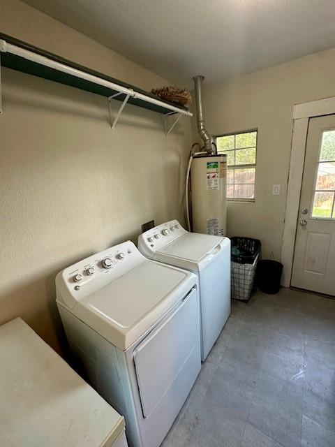 300 E Shoemaker St, Decatur, TX 76234 - washroom featuring gas water heater and washing machine and clothes dryer