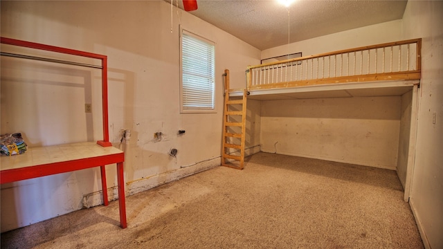 1106 Central Ave, Bowie, TX 76230 - unfurnished bedroom with carpet flooring and a textured ceiling