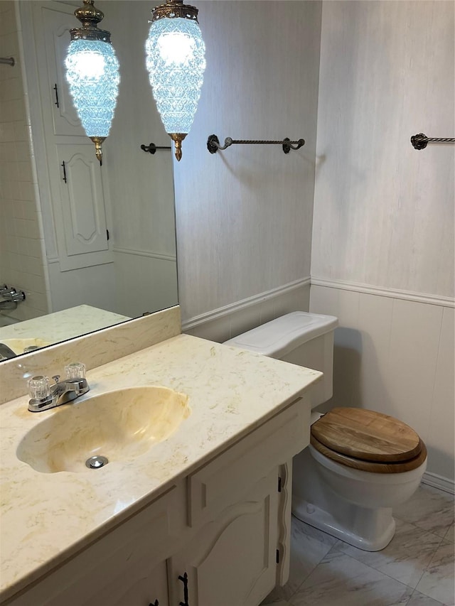 2420 Fairview Dr, Plano, TX 75075 - bathroom featuring marble finish flooring, toilet, and vanity