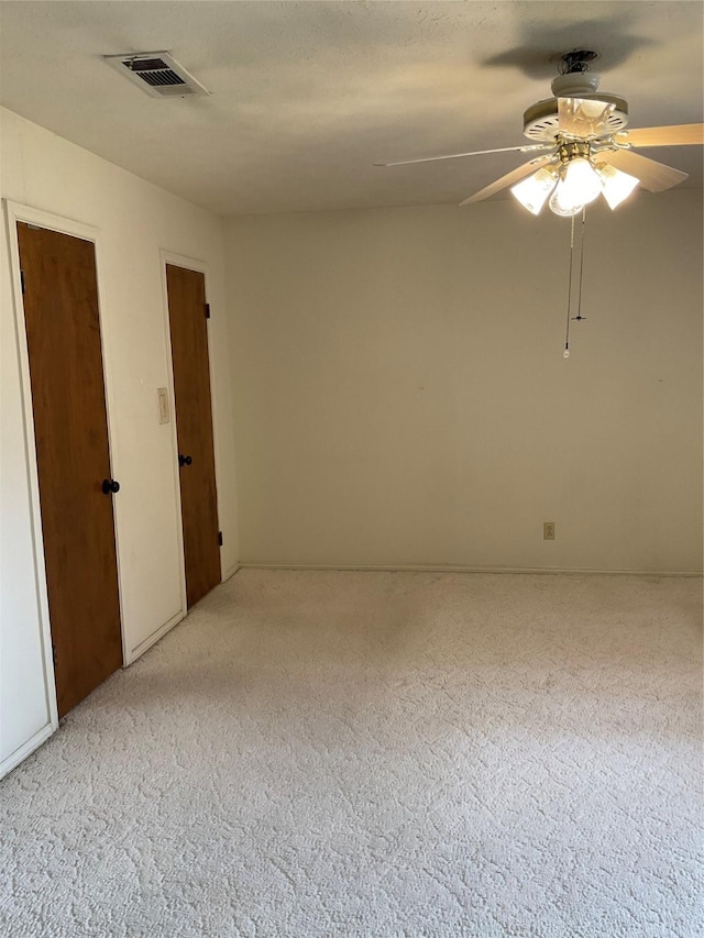 2420 Fairview Dr, Plano, TX 75075 - empty room featuring light carpet and a ceiling fan