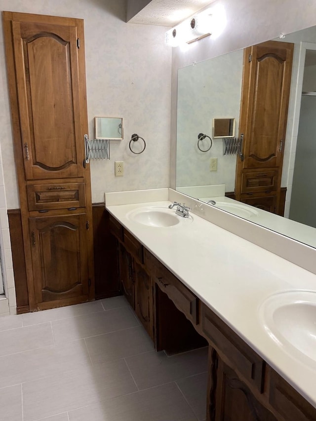 2420 Fairview Dr, Plano, TX 75075 - bathroom with double vanity and tile patterned flooring
