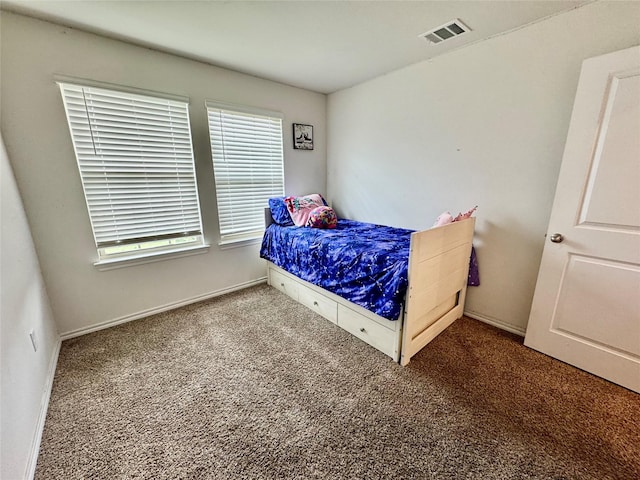 1013 Euston St, Denton, TX 76209 - bedroom with carpet floors, multiple windows, and baseboards