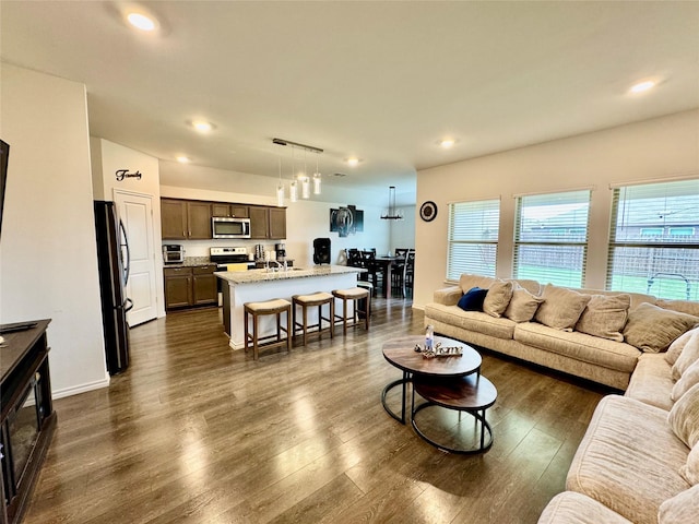 1013 Euston St, Denton, TX 76209 - living room featuring dark wood finished floors and recessed lighting