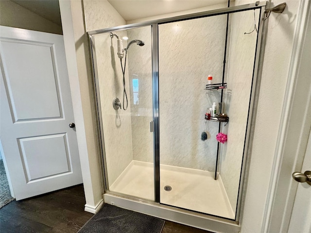 1013 Euston St, Denton, TX 76209 - bathroom featuring a stall shower and wood finished floors