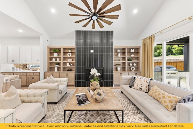 1044 Olympic Dr, Rockwall, TX 75087 - living area with recessed lighting, high vaulted ceiling, and a tile fireplace