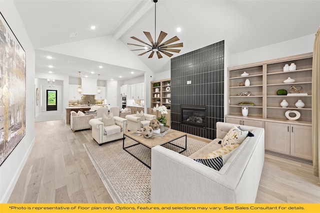 1044 Olympic Dr, Rockwall, TX 75087 - living room with beamed ceiling, light wood-style flooring, a tile fireplace, recessed lighting, and high vaulted ceiling