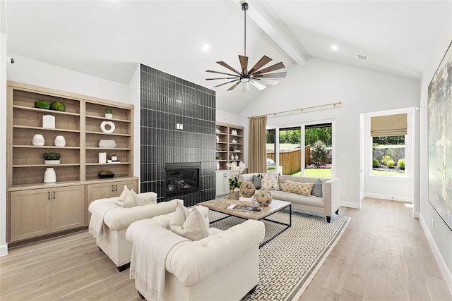 1044 Olympic Dr, Rockwall, TX 75087 - living area with a large fireplace, light wood-style flooring, a ceiling fan, baseboards, and recessed lighting
