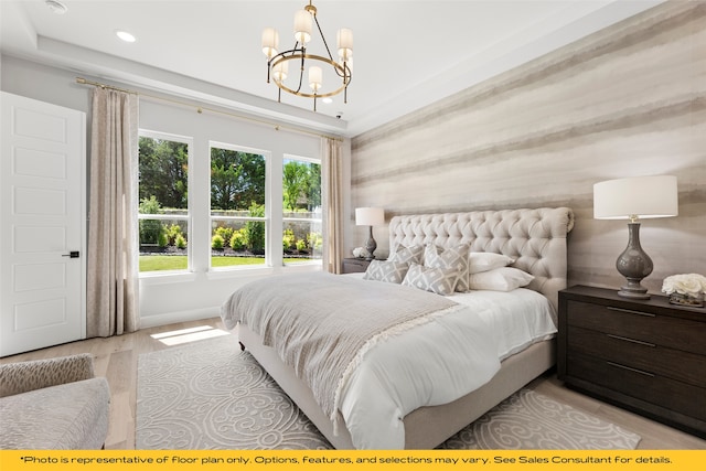 1044 Olympic Dr, Rockwall, TX 75087 - bedroom with a chandelier, recessed lighting, wood finished floors, and baseboards