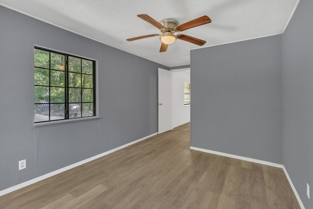 84 Natchez Rd, Pottsboro, TX 75076 - empty room featuring wood finished floors, ceiling fan, baseboards, and crown molding