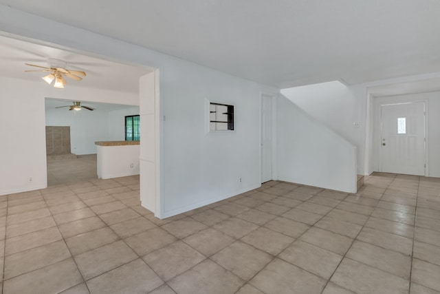 84 Natchez Rd, Pottsboro, TX 75076 - unfurnished room featuring ceiling fan, light tile patterned flooring, and baseboards