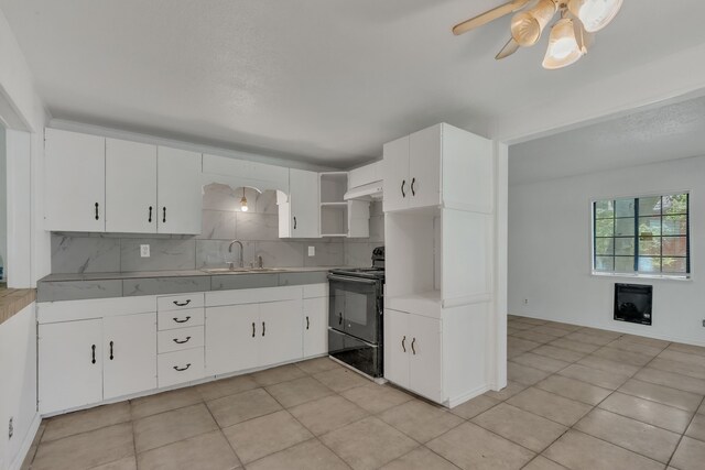 84 Natchez Rd, Pottsboro, TX 75076 - kitchen with black range with electric cooktop, a sink, under cabinet range hood, open shelves, and a ceiling fan
