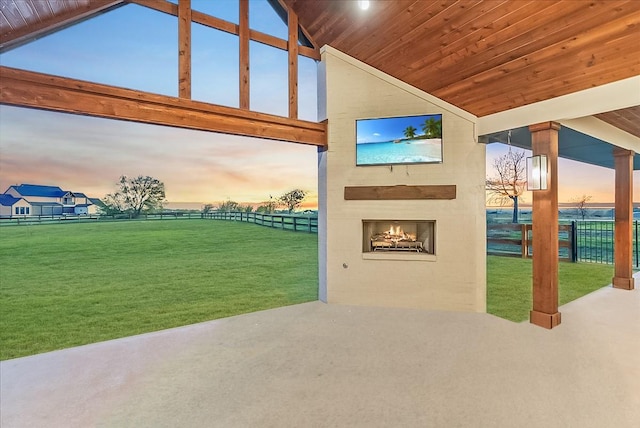 3417 Dovehill Dr, Northlake, TX 76247 - view of patio with a warm lit fireplace