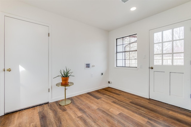 130 Holland Dr, Denison, TX 75020 - doorway featuring wood finished floors, baseboards, and recessed lighting