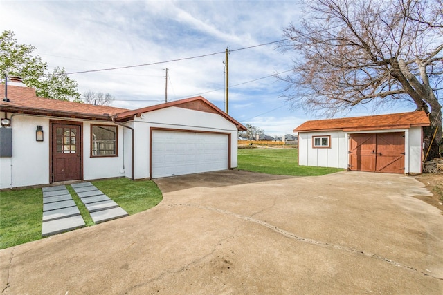 130 Holland Dr, Denison, TX 75020 - garage with driveway and a storage shed