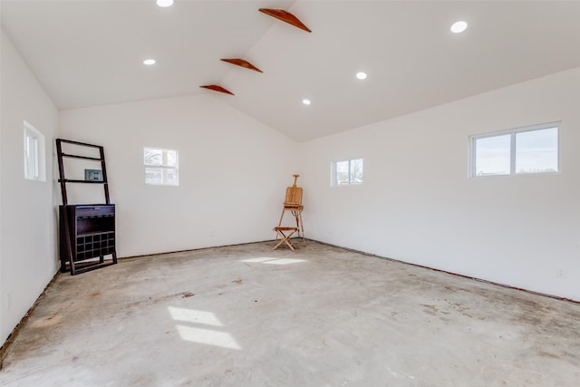 130 Holland Dr, Denison, TX 75020 - unfurnished room featuring recessed lighting, lofted ceiling, and unfinished concrete floors