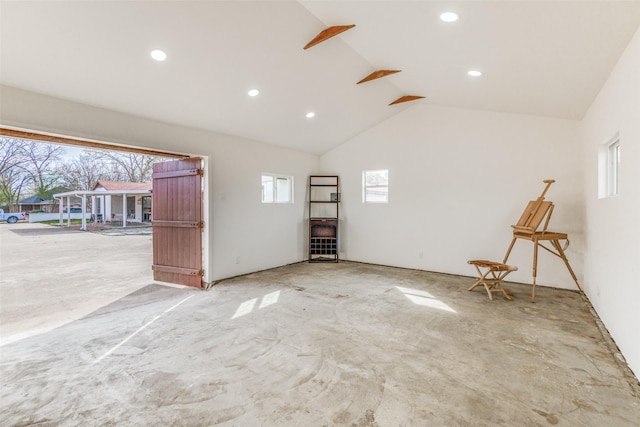 130 Holland Dr, Denison, TX 75020 - spare room with plenty of natural light, recessed lighting, and high vaulted ceiling