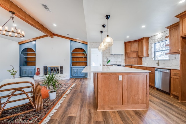 130 Holland Dr, Denison, TX 75020 - kitchen with dishwasher, light countertops, wood finished floors, decorative backsplash, and a kitchen island