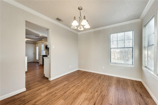 3610 Peakview Dr, Corinth, TX 76210 - unfurnished room featuring a chandelier, light wood-type flooring, crown molding, and baseboards